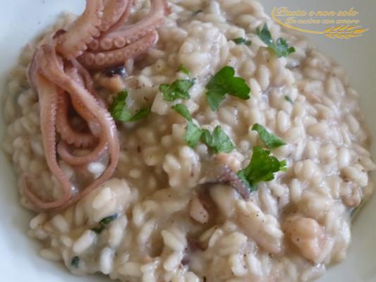 Risotto con melanzana, pesce spada, moscardini e seppia